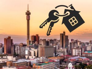 MDS AUCTION REPOSESSED 01 2 - Municipal Debt Specialist City skyline at sunset with a large black key and house icon hovering above, symbolizing home ownership or real estate security.