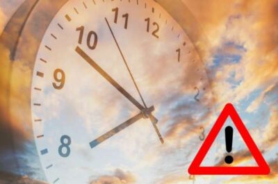 - Municipal Debt Specialist Clock face with overlapping warning triangle and exclamation mark, signaling a time-related alert or deadline