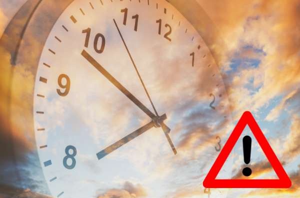 Clock face with overlapping warning triangle and exclamation mark, signaling a time-related alert or deadline